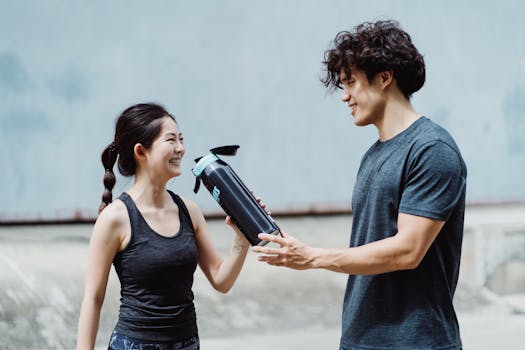 man drinking water during workout