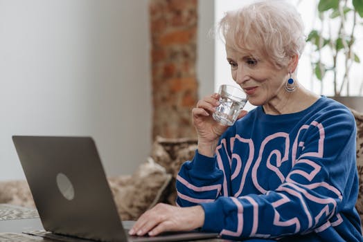 a person drinking water while working