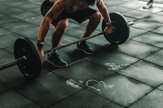 image of a man lifting weights