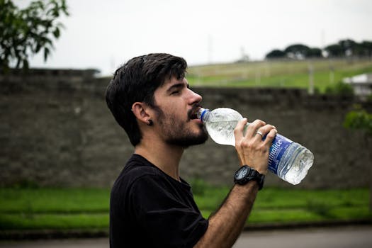 image of a man drinking water